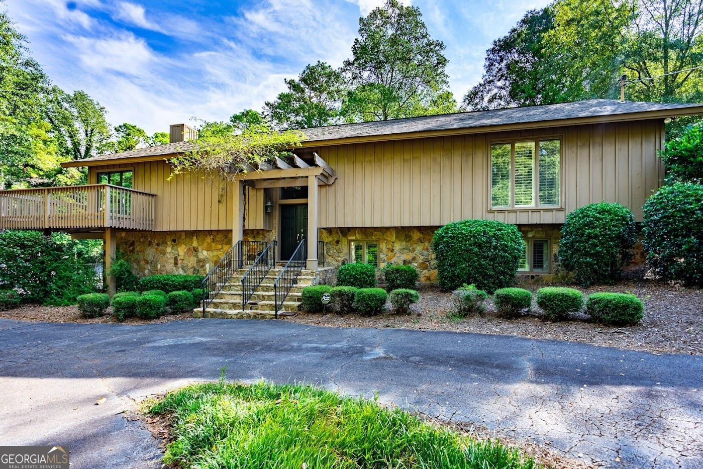 a front view of a house with garden