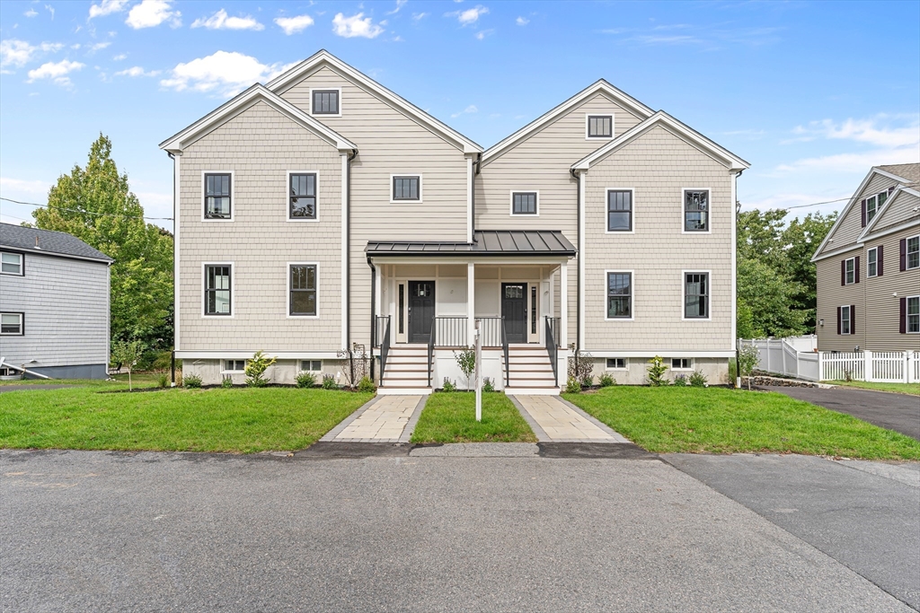 front view of a house with a yard