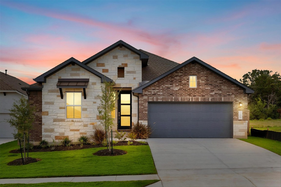 a front view of a house with yard