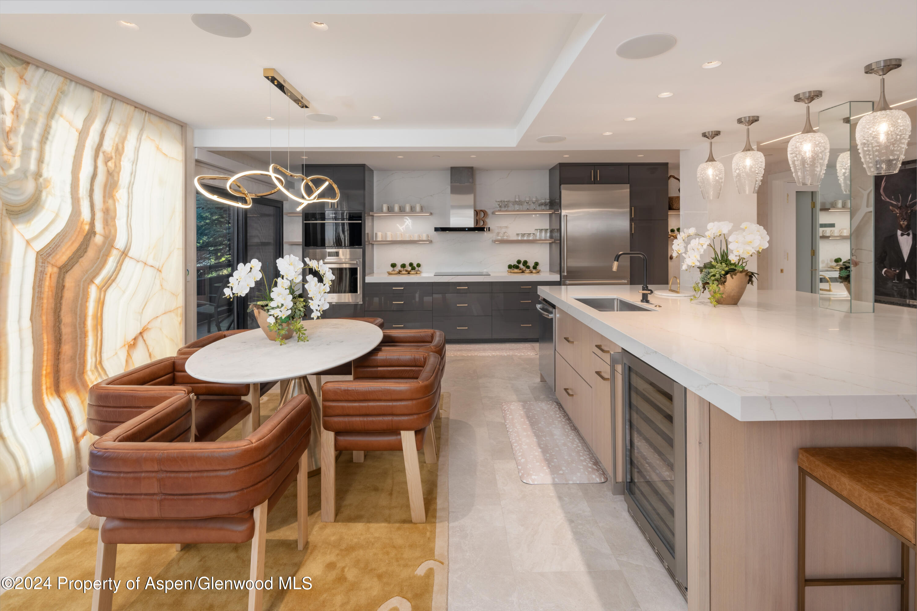 a kitchen with granite countertop kitchen island stainless steel appliances a sink and a center island