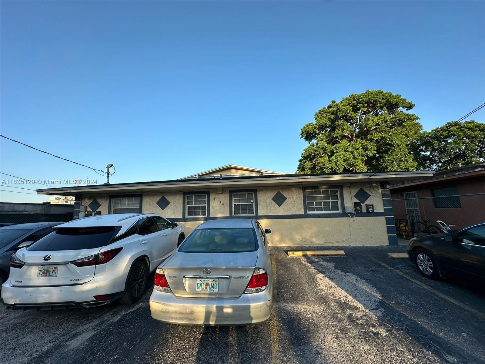 a car parked in front of a house