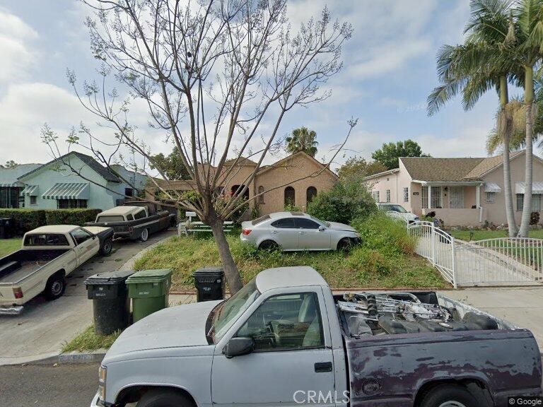 a view of multiple houses with outdoor space