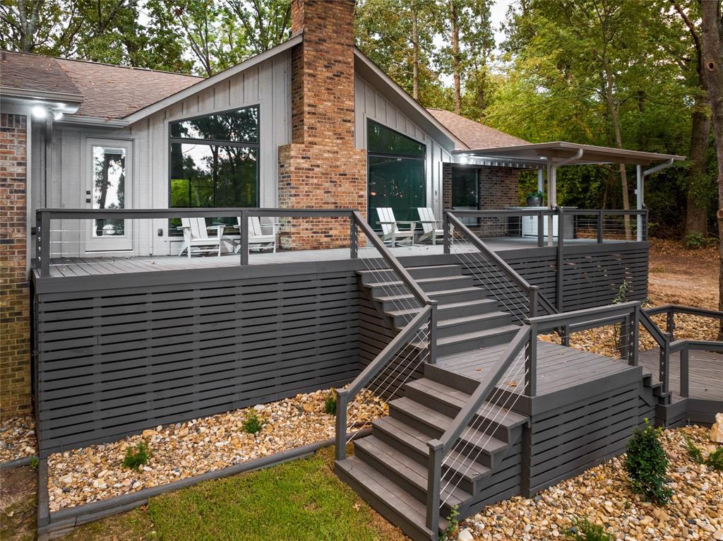 a view of outdoor kitchen and seating area