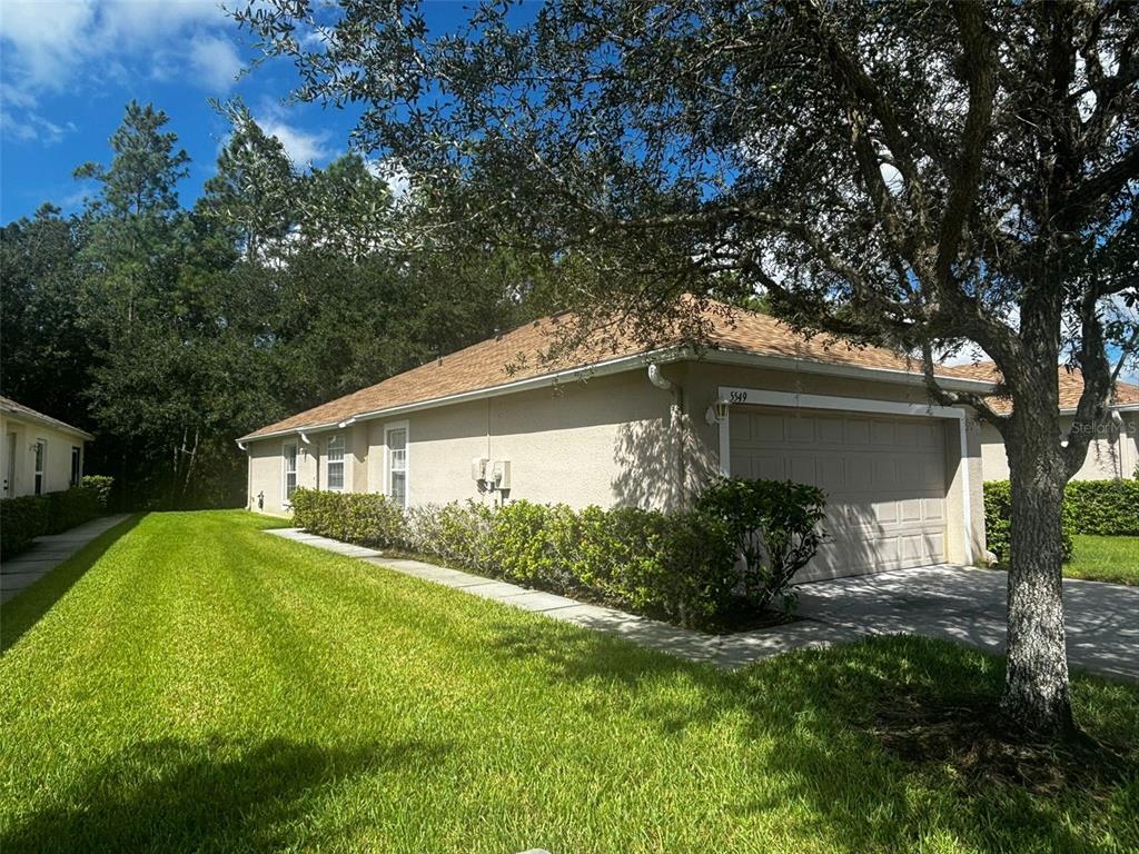 a view of a house with a yard