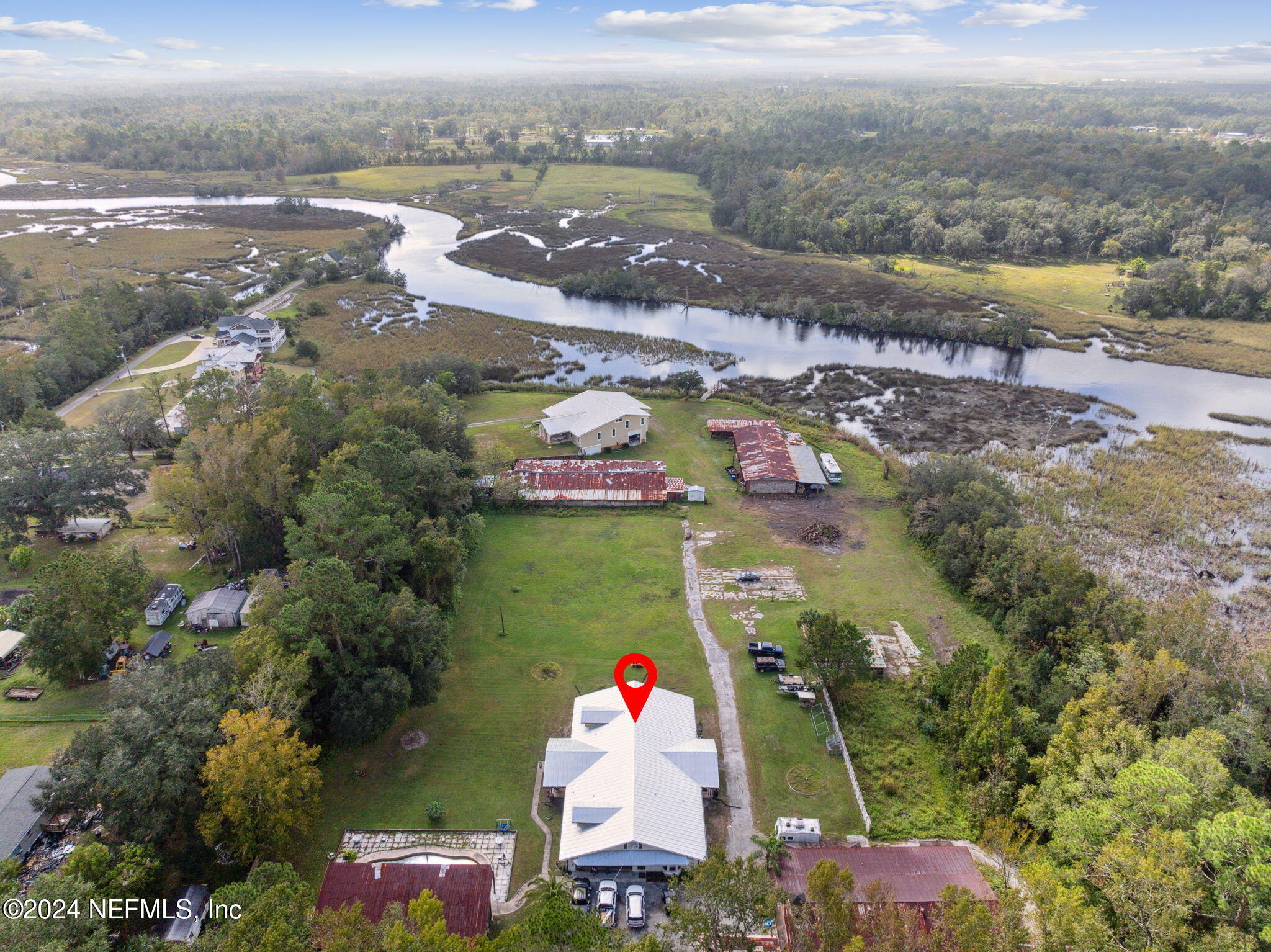 an aerial view of residential houses with outdoor space