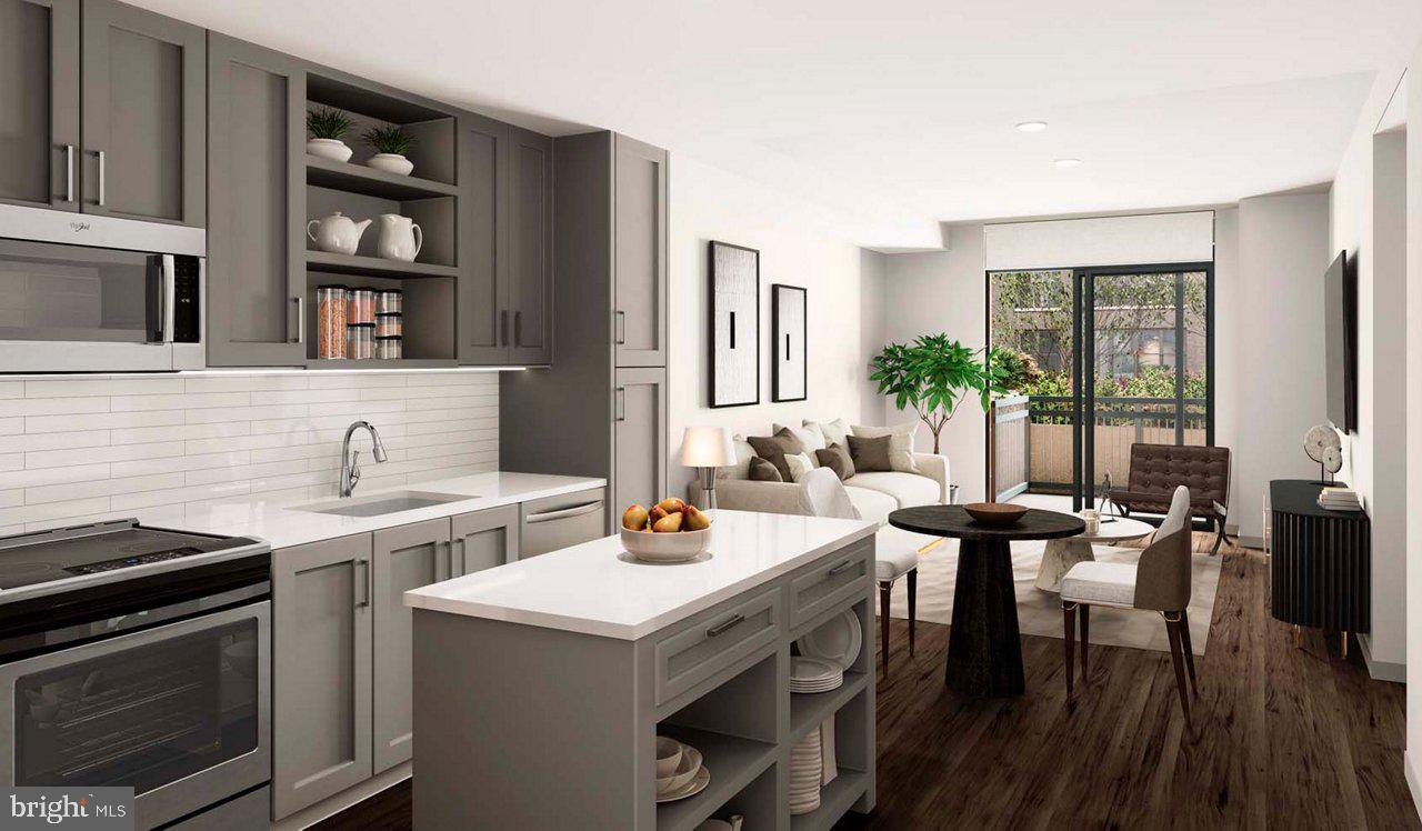 a view of a kitchen with a table and chairs