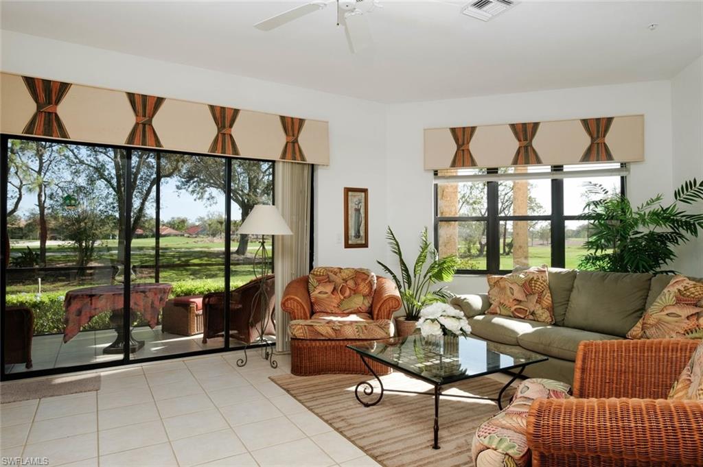 Sunroom / solarium featuring ceiling fan