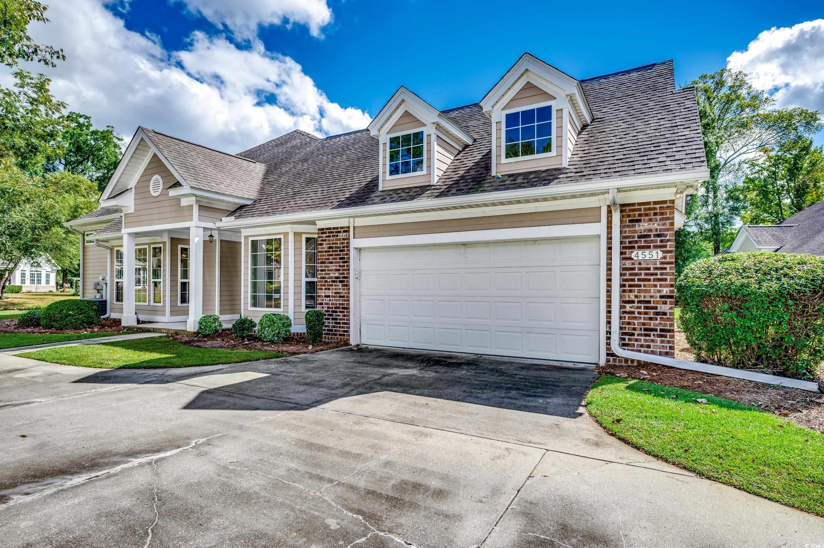 Cape cod-style house with a garage