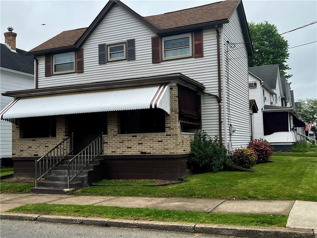 a front view of a house with a yard