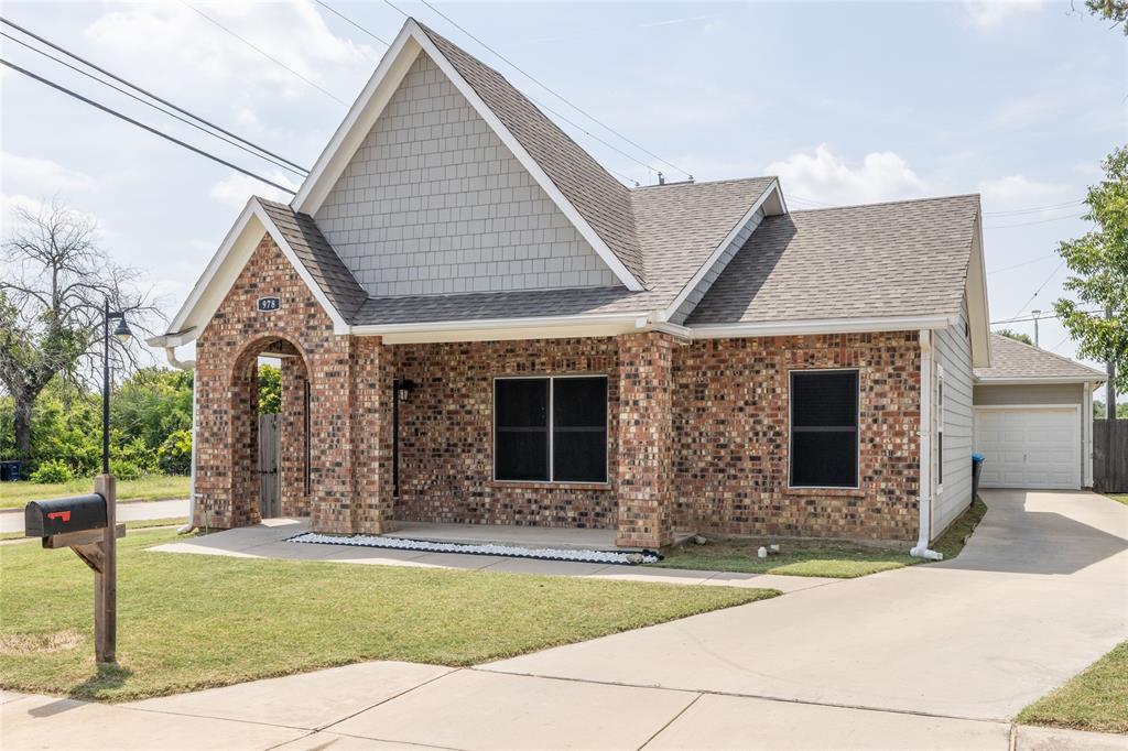 a front view of house with outdoor space