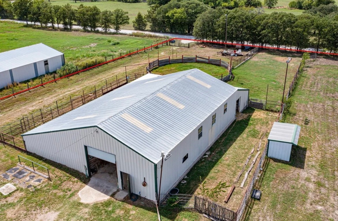 an aerial view of a house with a big yard