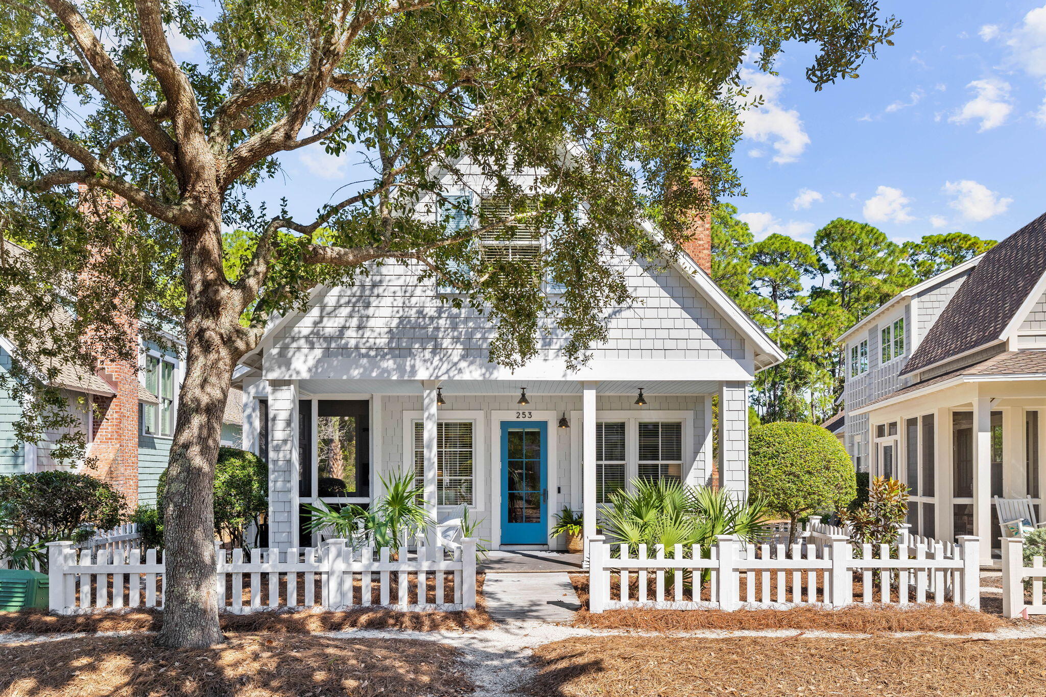 a front view of a house with a garden