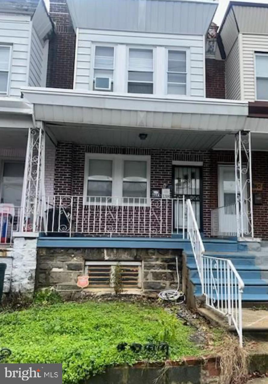 front view of a house with a small yard