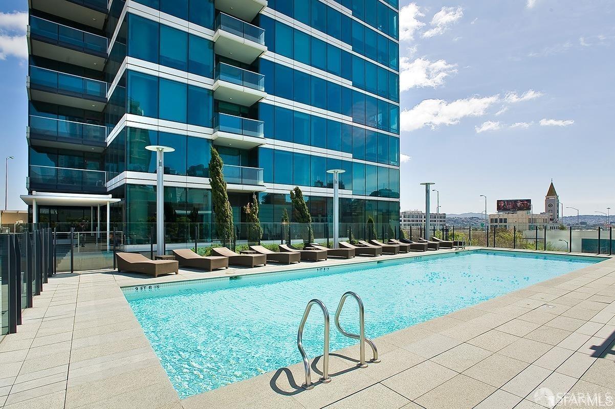 a view of a backyard with sitting area and slide