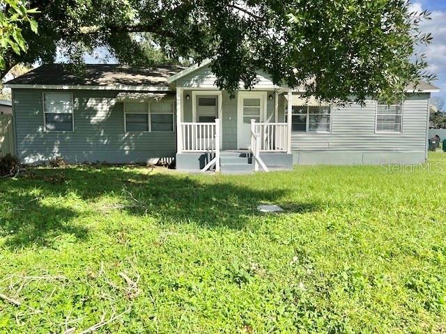 a front view of a house with a yard table and chairs