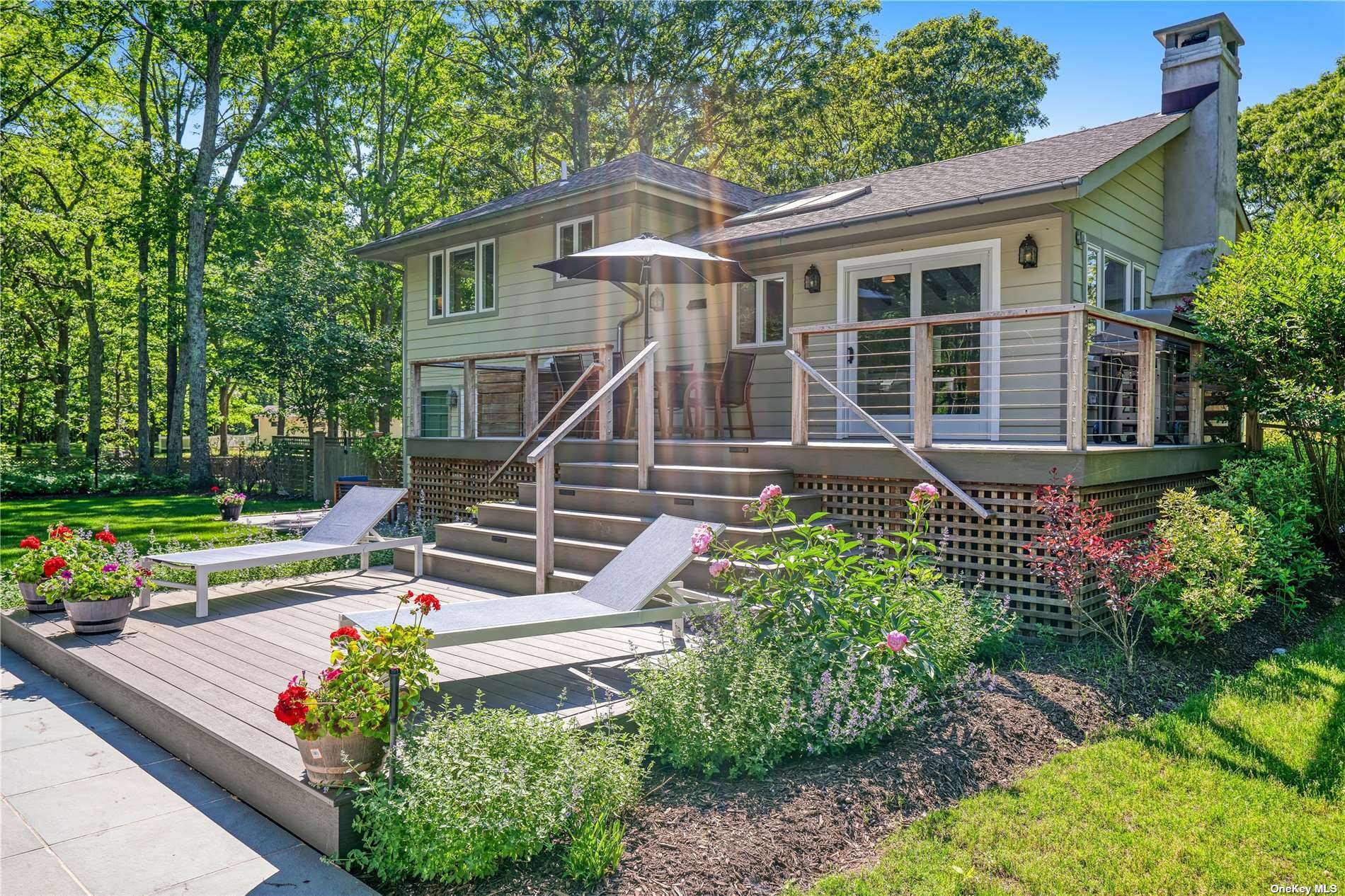 a view of a house with a yard and garden