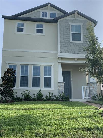 a front view of house with yard