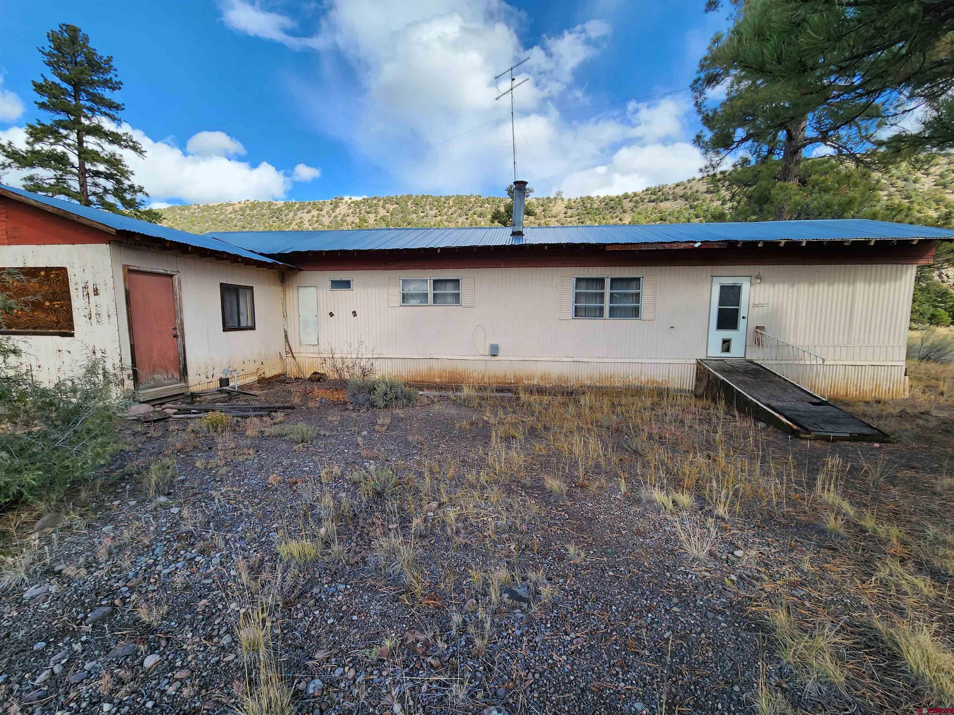 a view of a backyard of the house