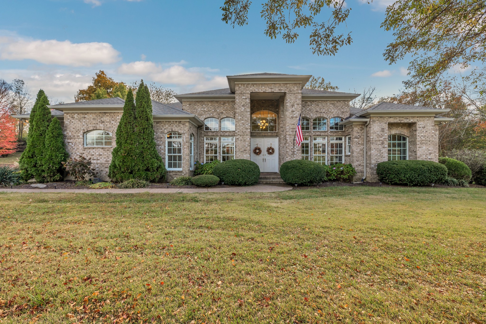 a front view of a house with garden