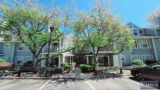 a front view of a building with sitting area