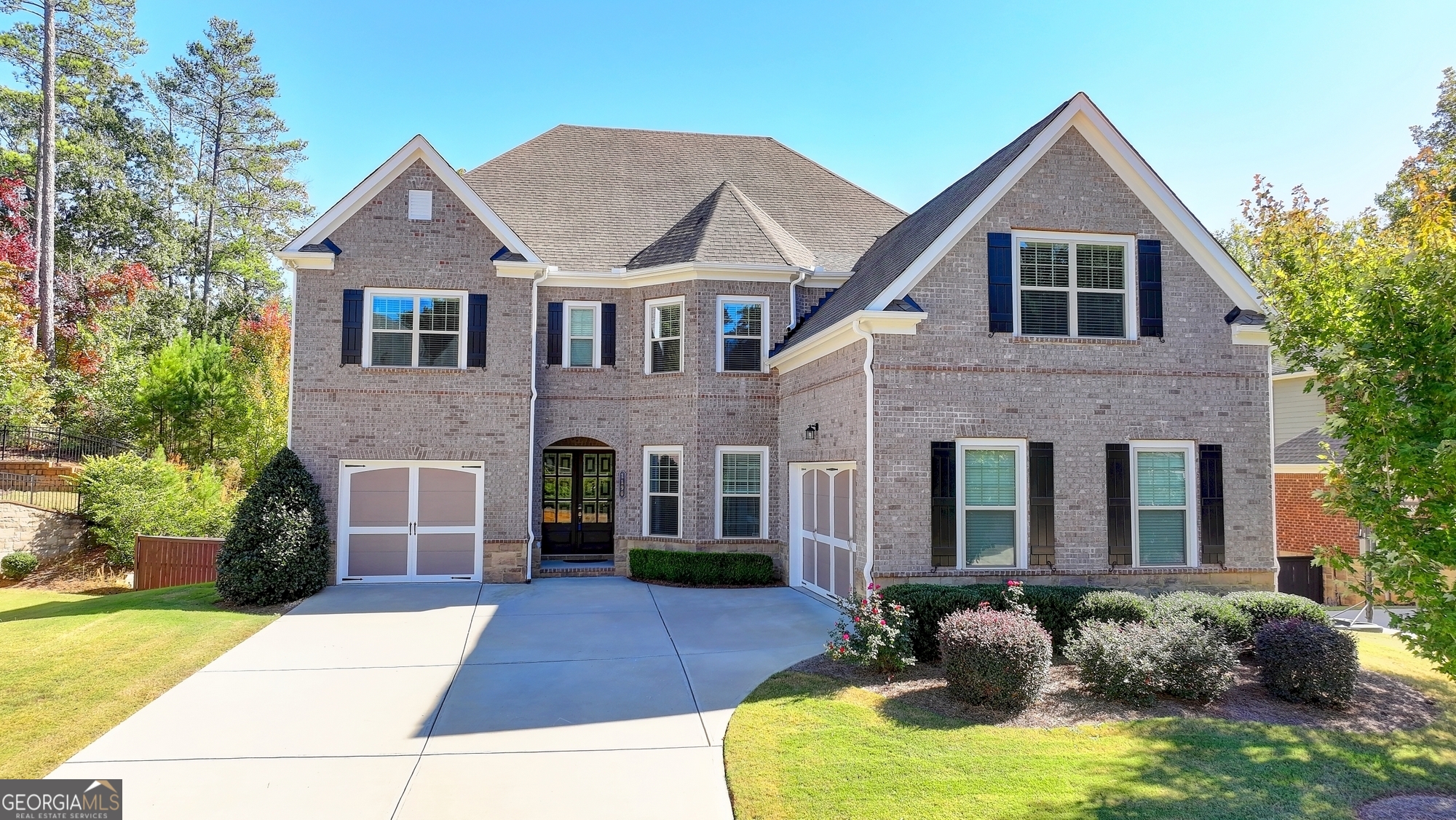 a front view of a house with a yard