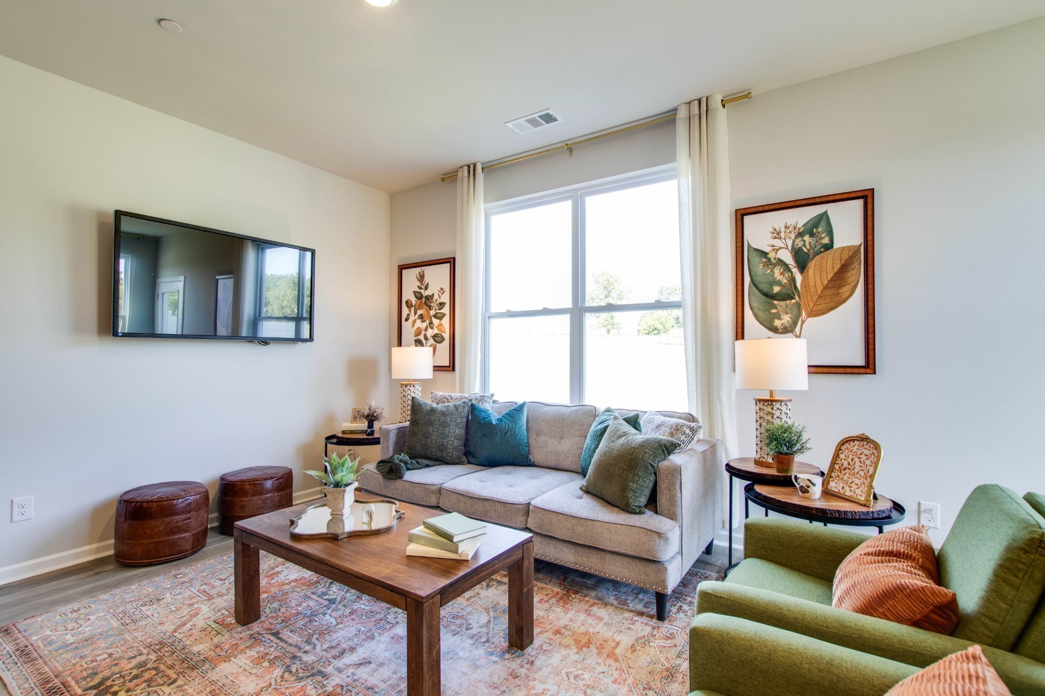 Living room has double windows and glass patio door for lots of natural light!