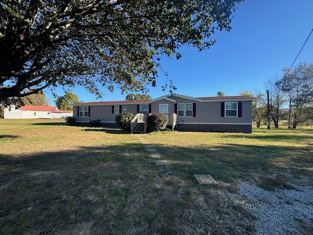 a view of a house with a big yard