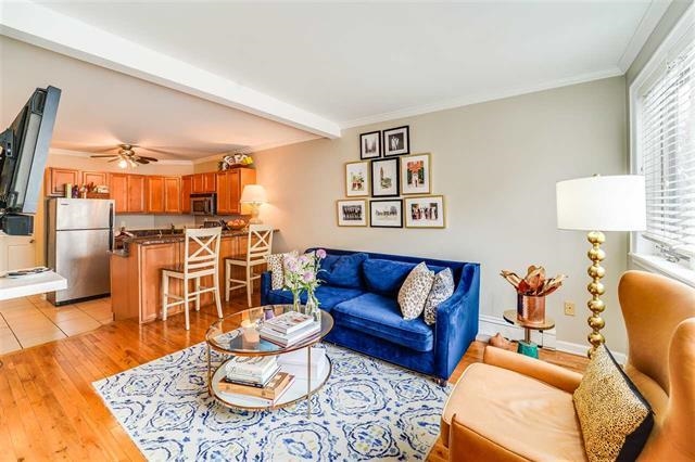 a living room with furniture and a rug