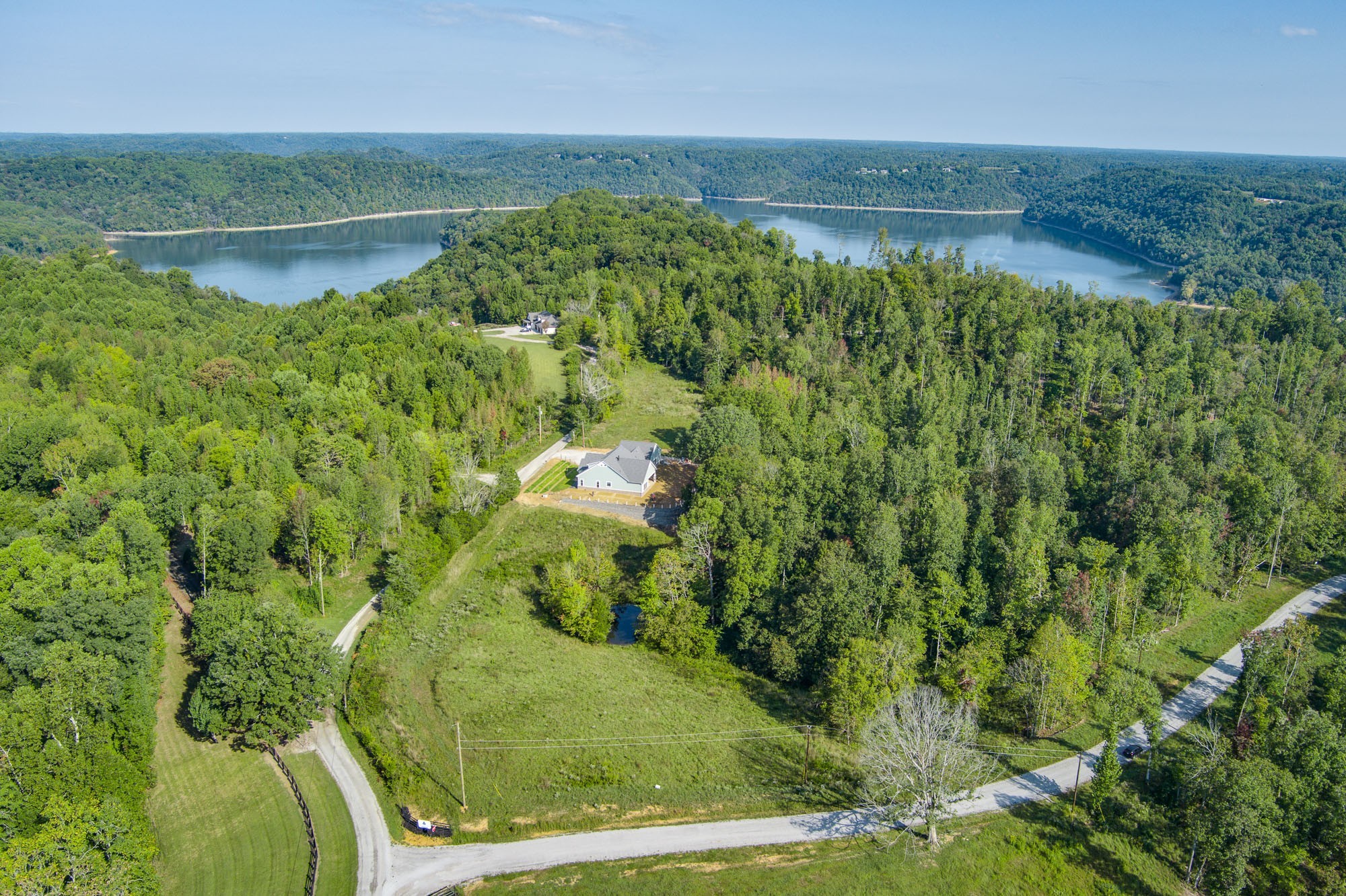 a view of a lake with a yard