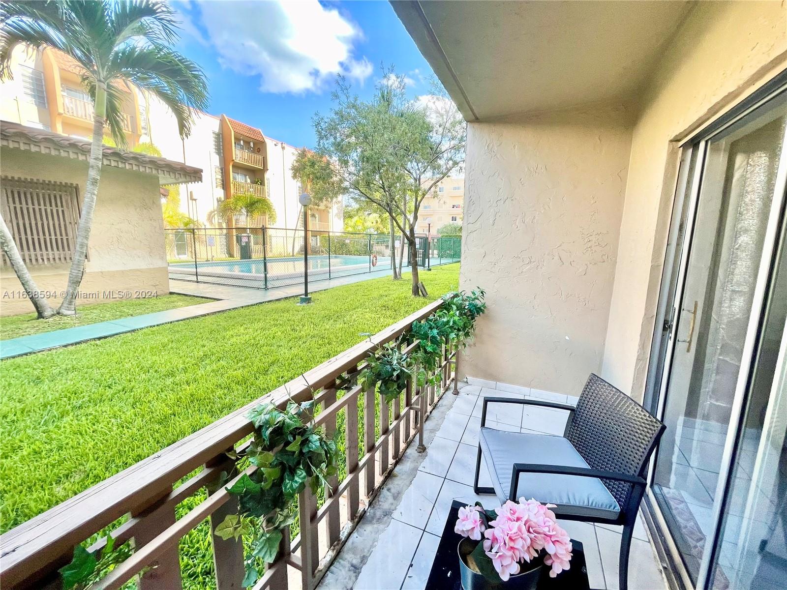 a view of yard from deck having patio