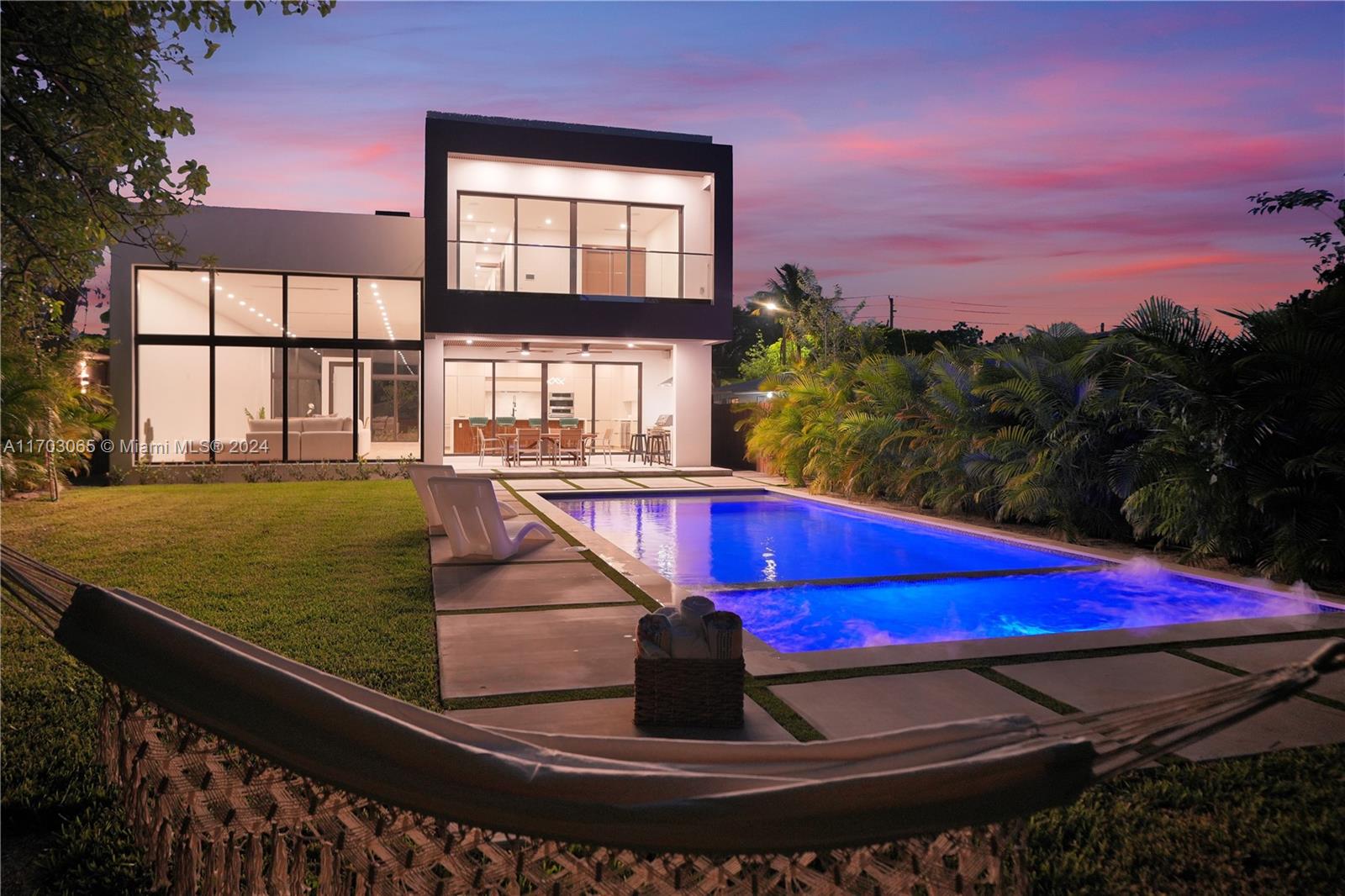 a view of a pool with sitting area