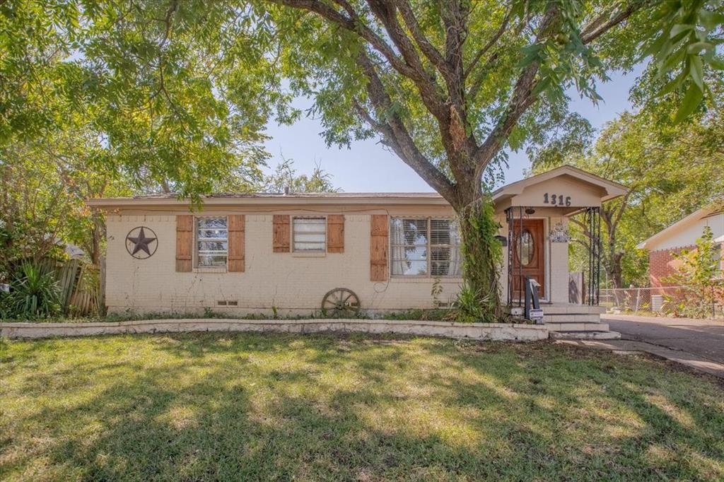 a front view of a house with yard