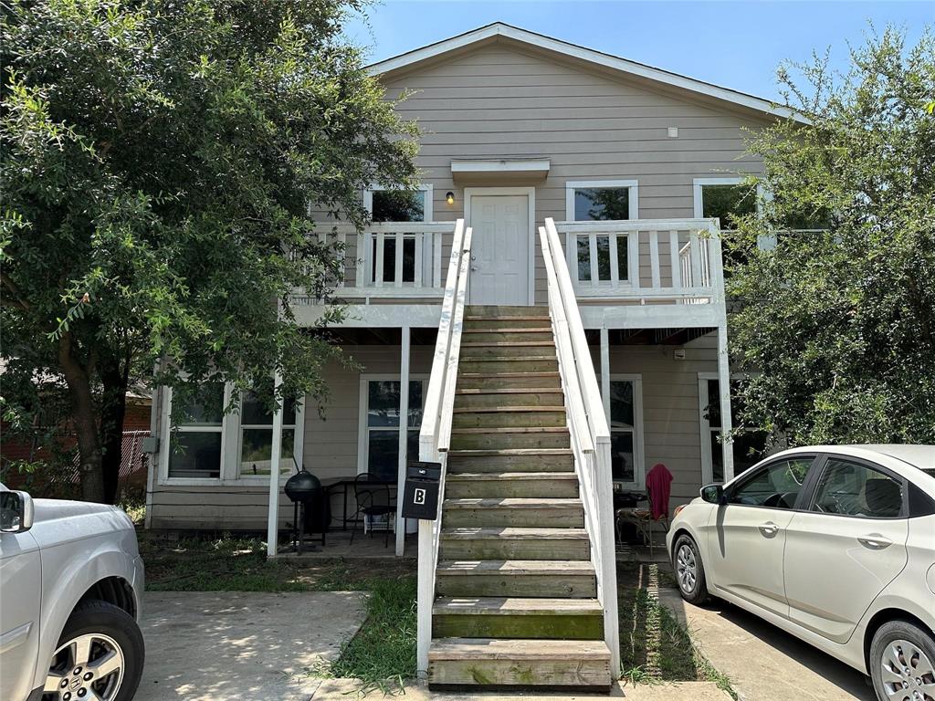 a front view of a house with parking space