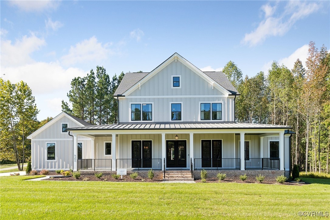 a front view of a house with swimming pool and porch