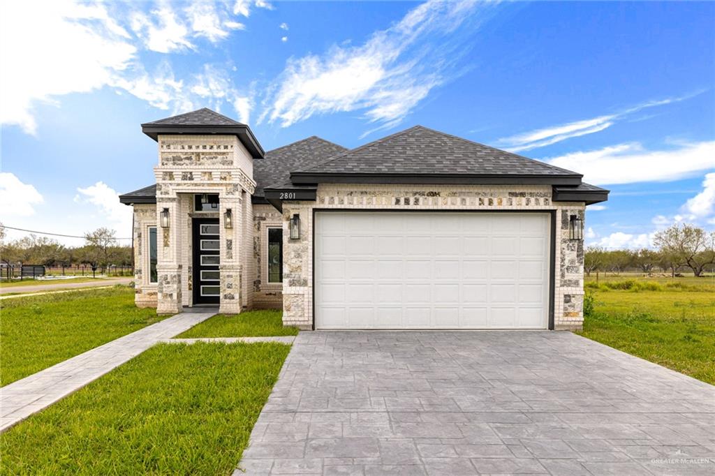 a front view of a house with yard