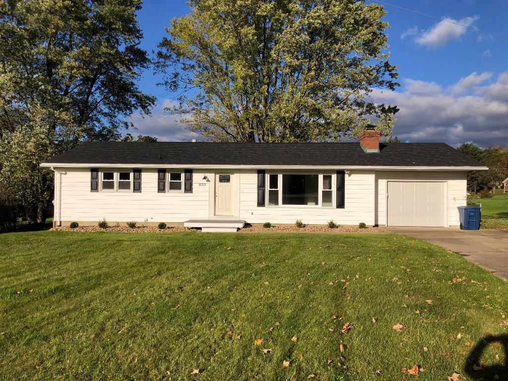 front view of a house with a big yard