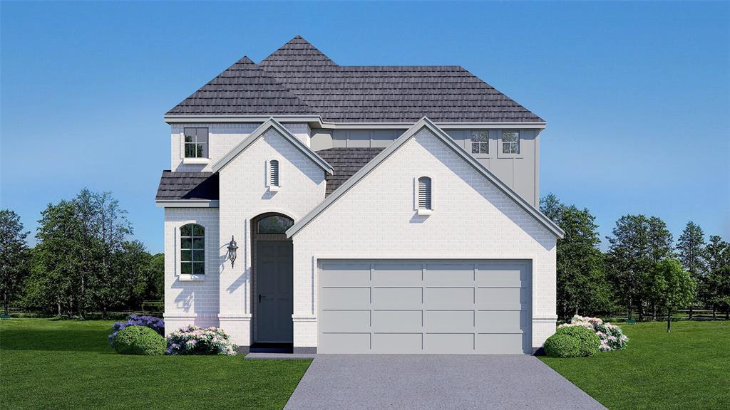 a front view of a house with a yard and trees