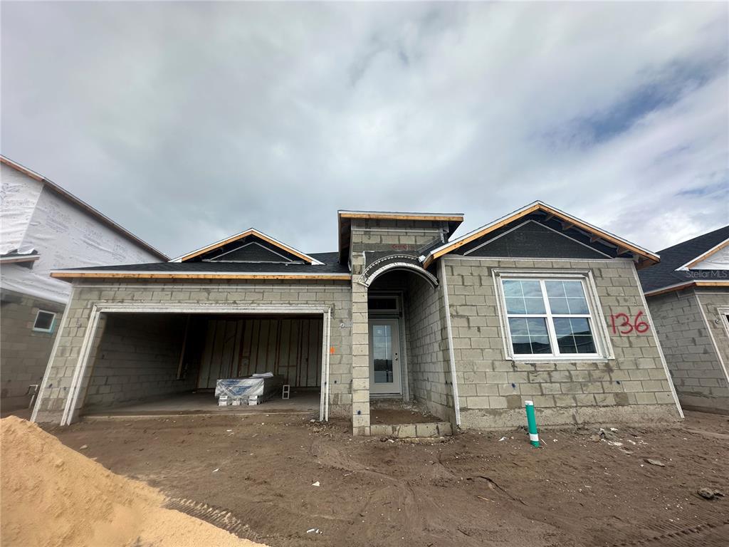 a front view of a house with garage