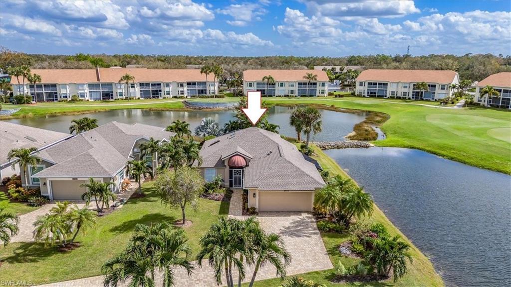 an aerial view of a houses with outdoor space and lake view