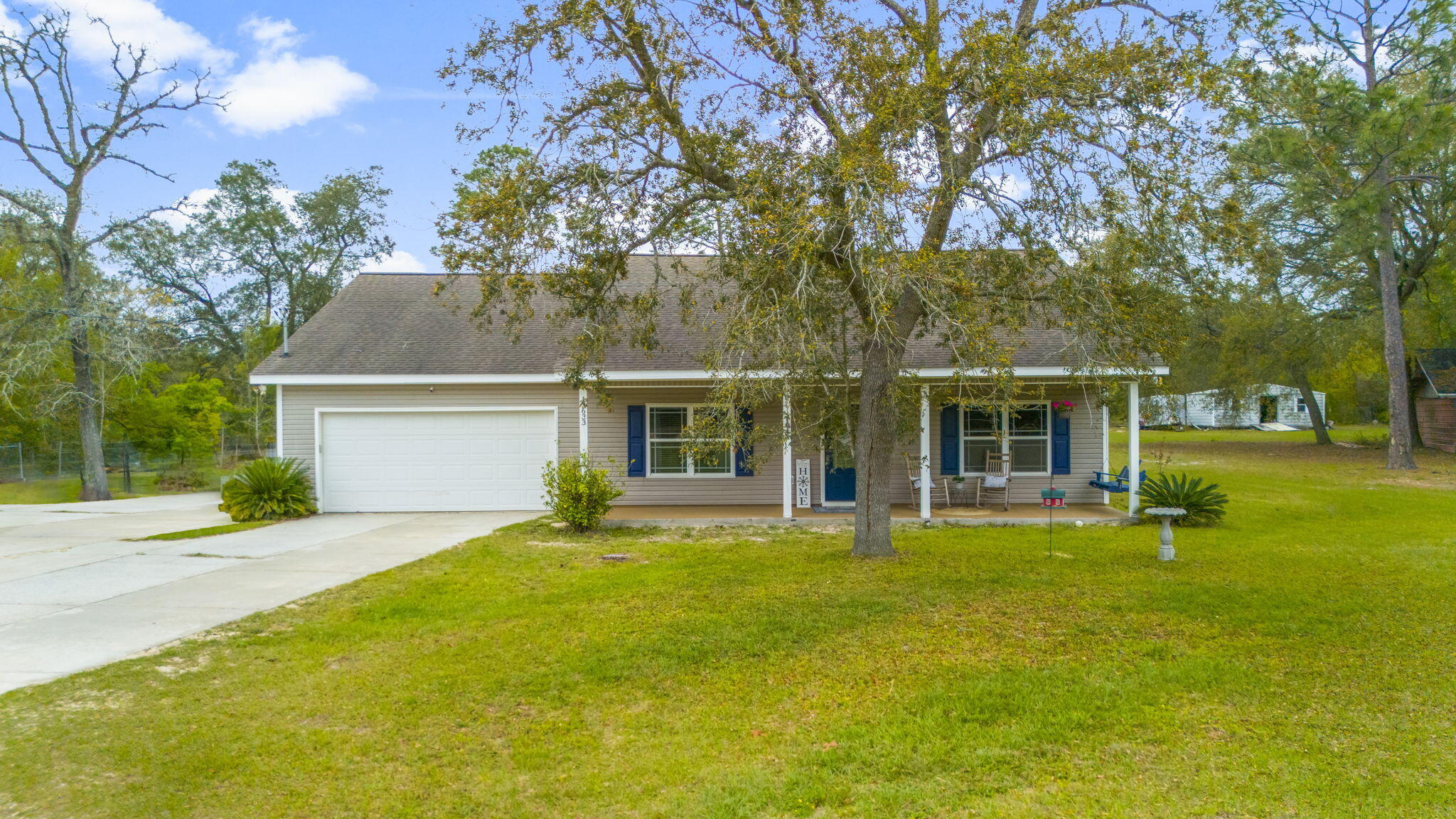 front view of a house with a yard