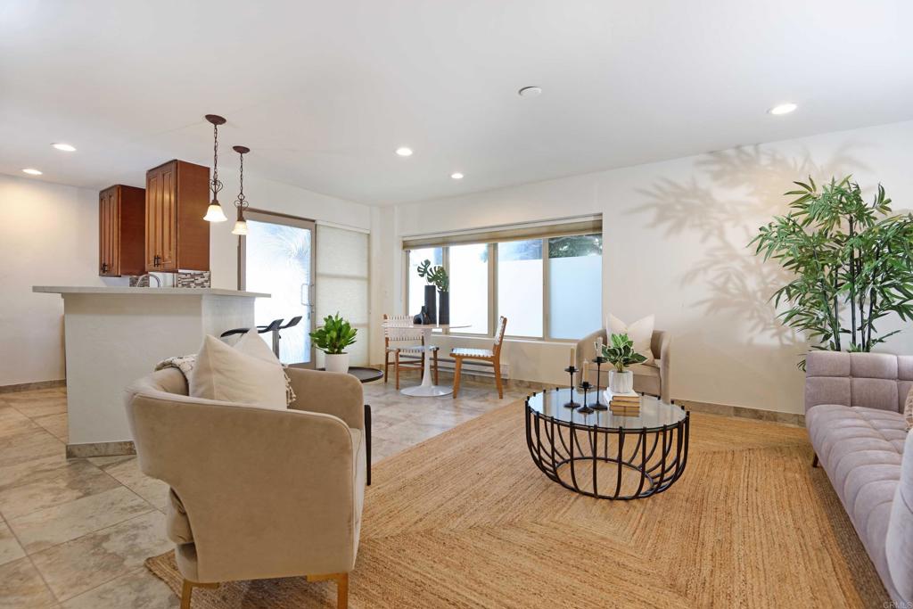 a living room with furniture and a potted plant