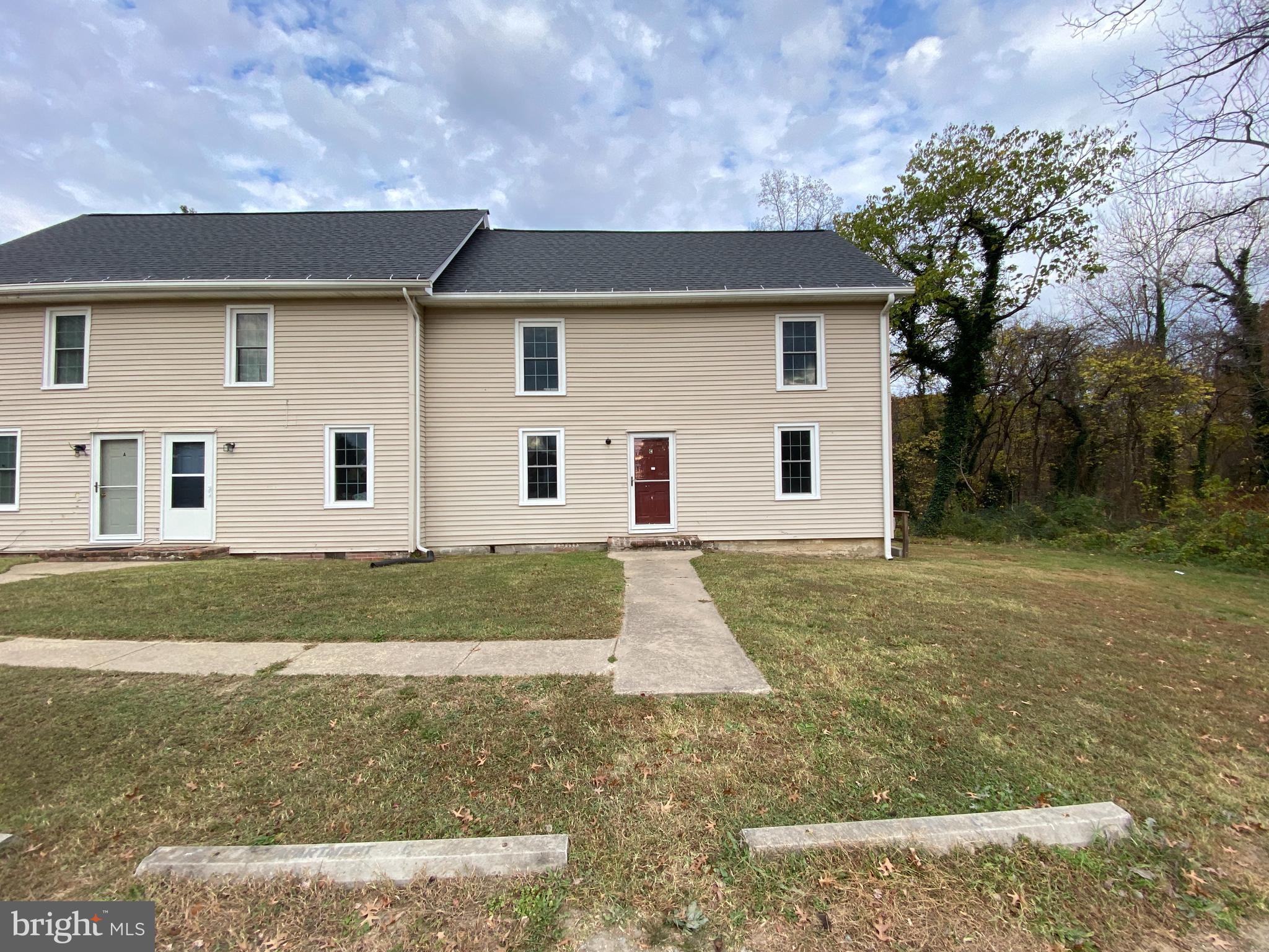 front view of a house and a yard