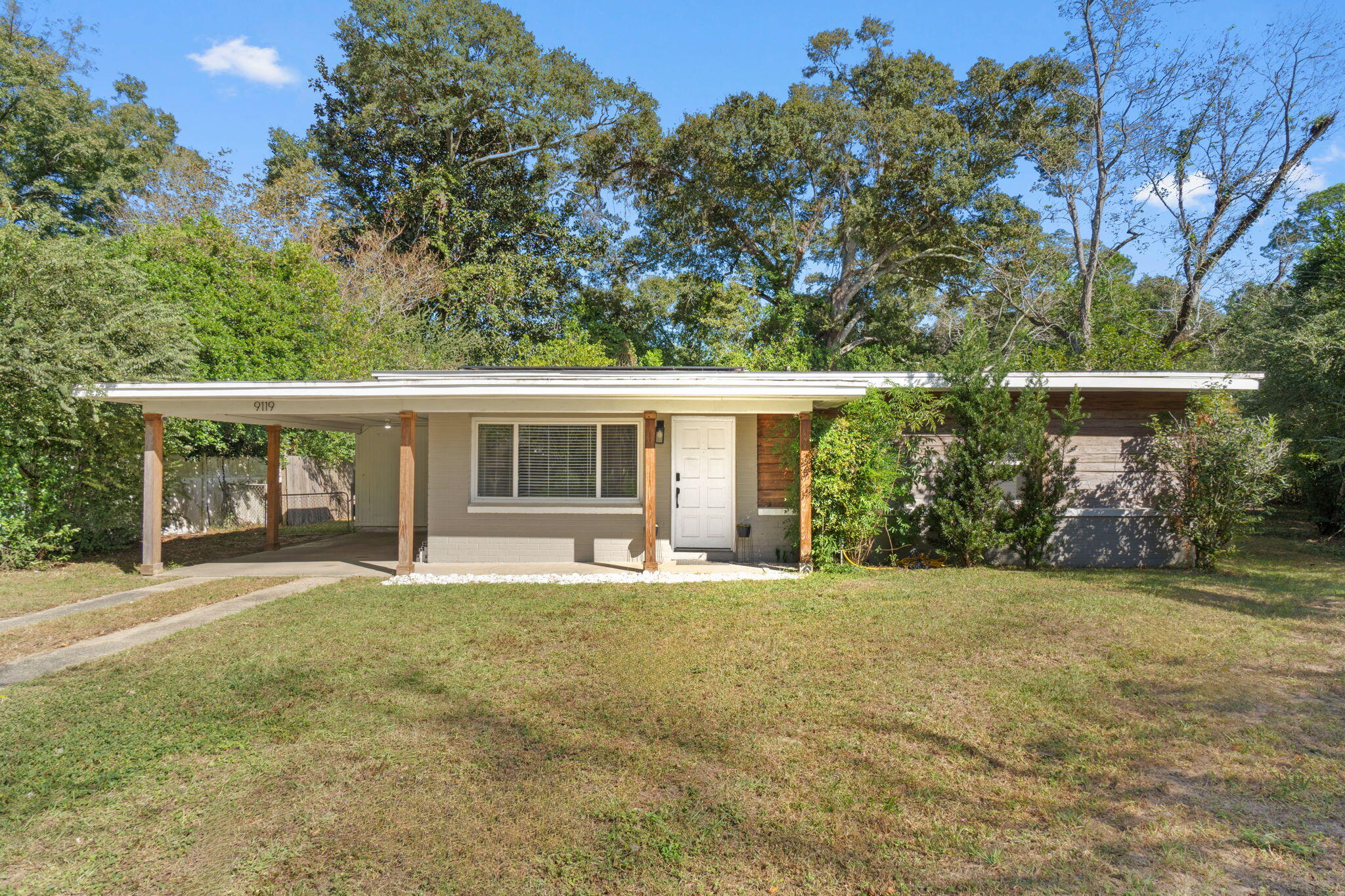 front view of a house with a yard