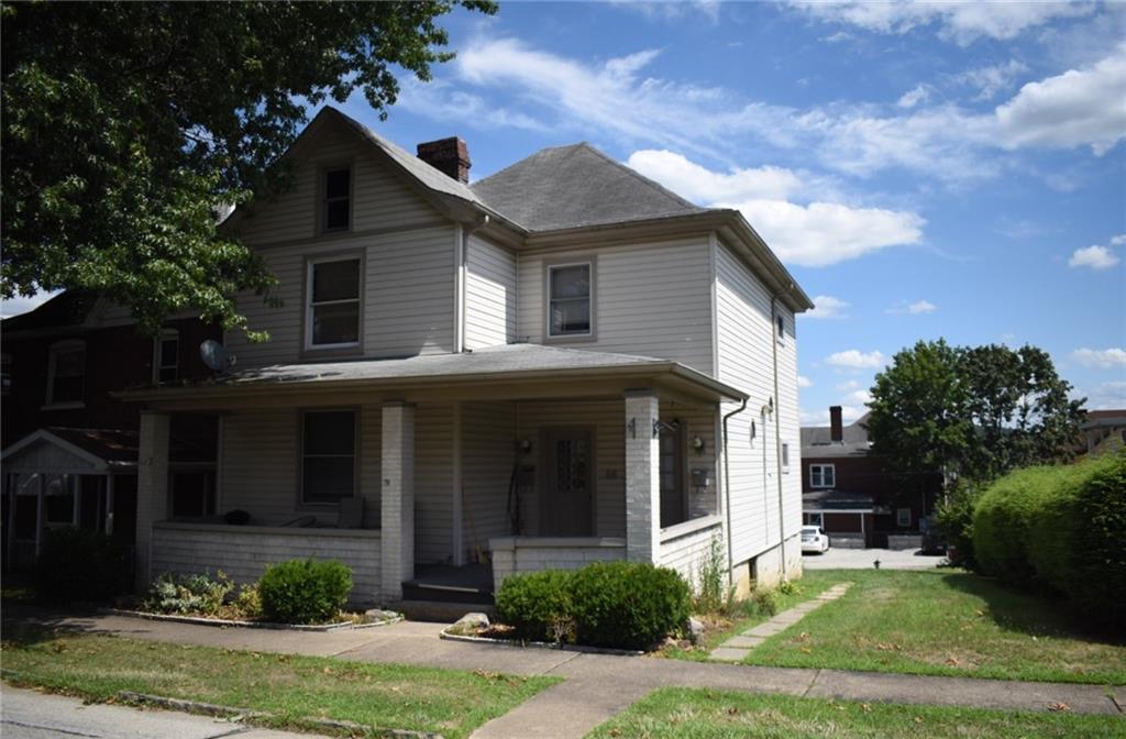 front view of a house with a yard