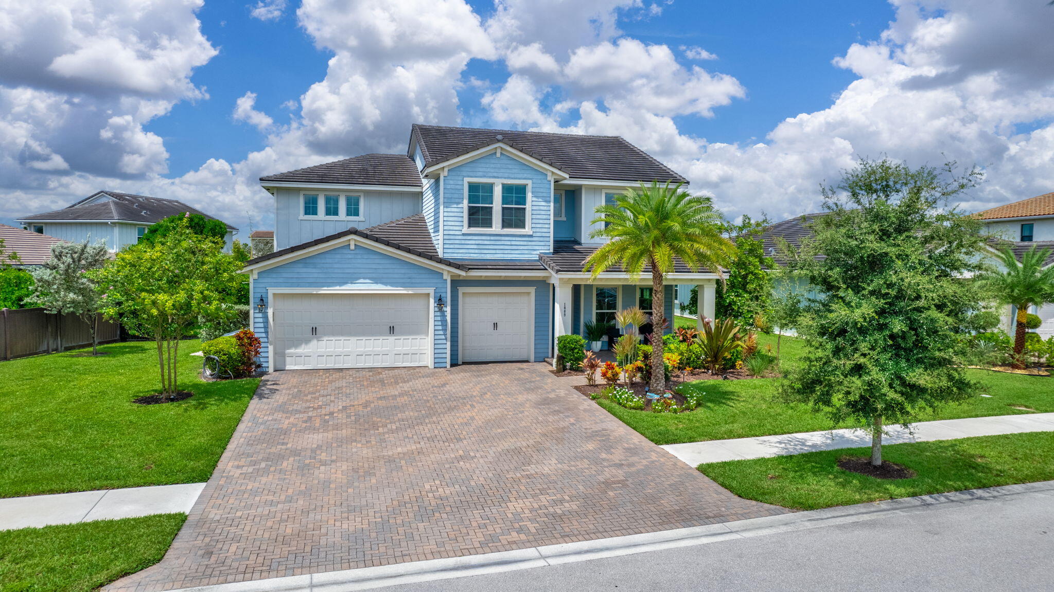 a front view of a house with garden