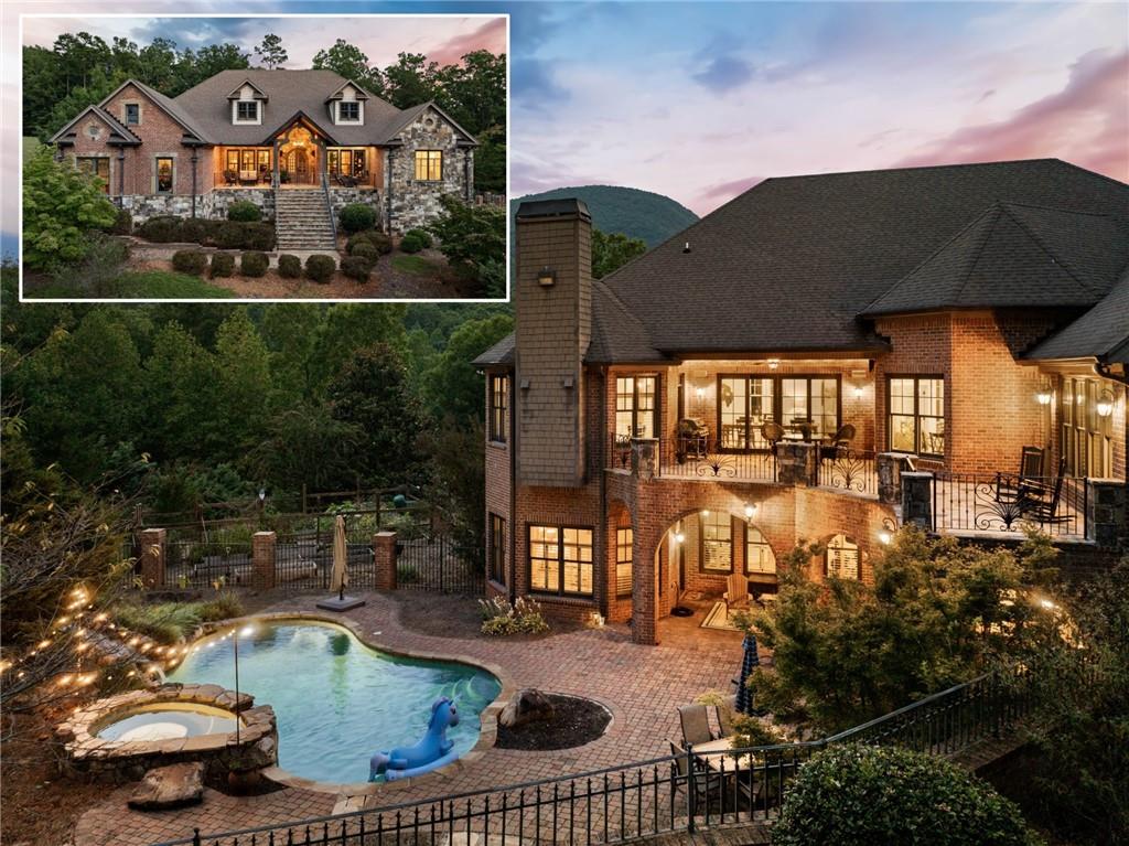 an aerial view of a house with a swimming pool patio and outdoor seating