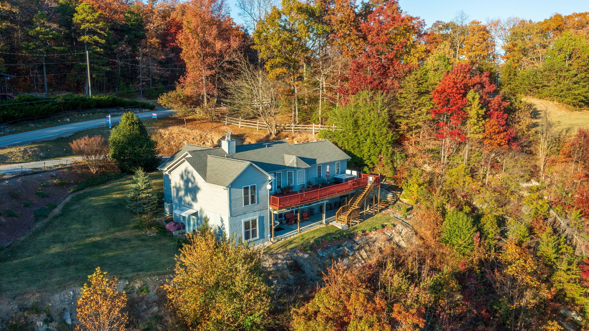 an aerial view of a house with a yard basket ball court and outdoor seating