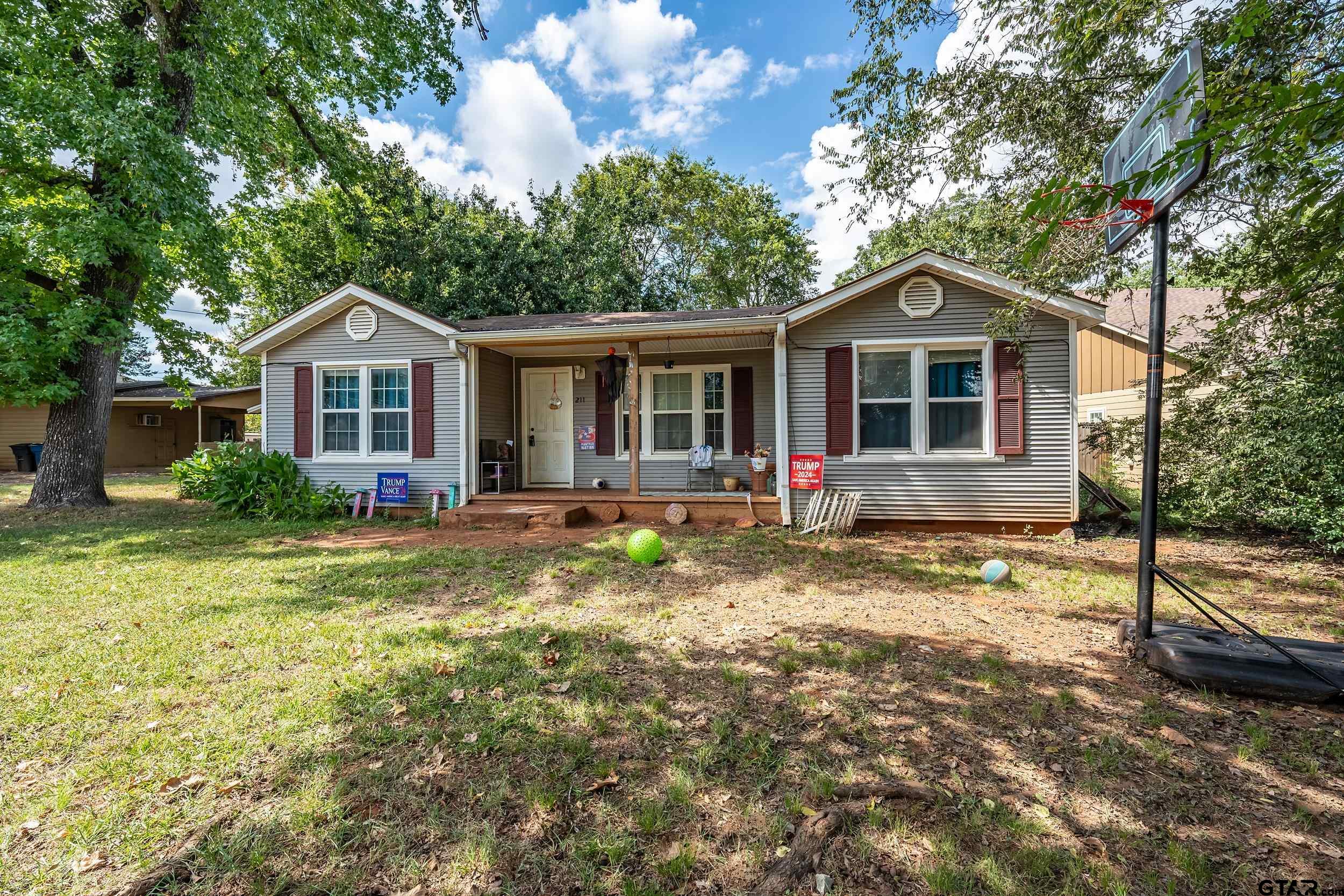 a front view of a house with a yard