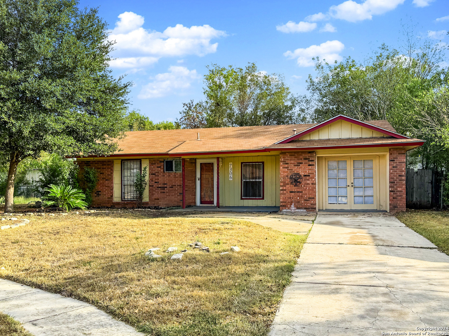 a front view of a house with yard