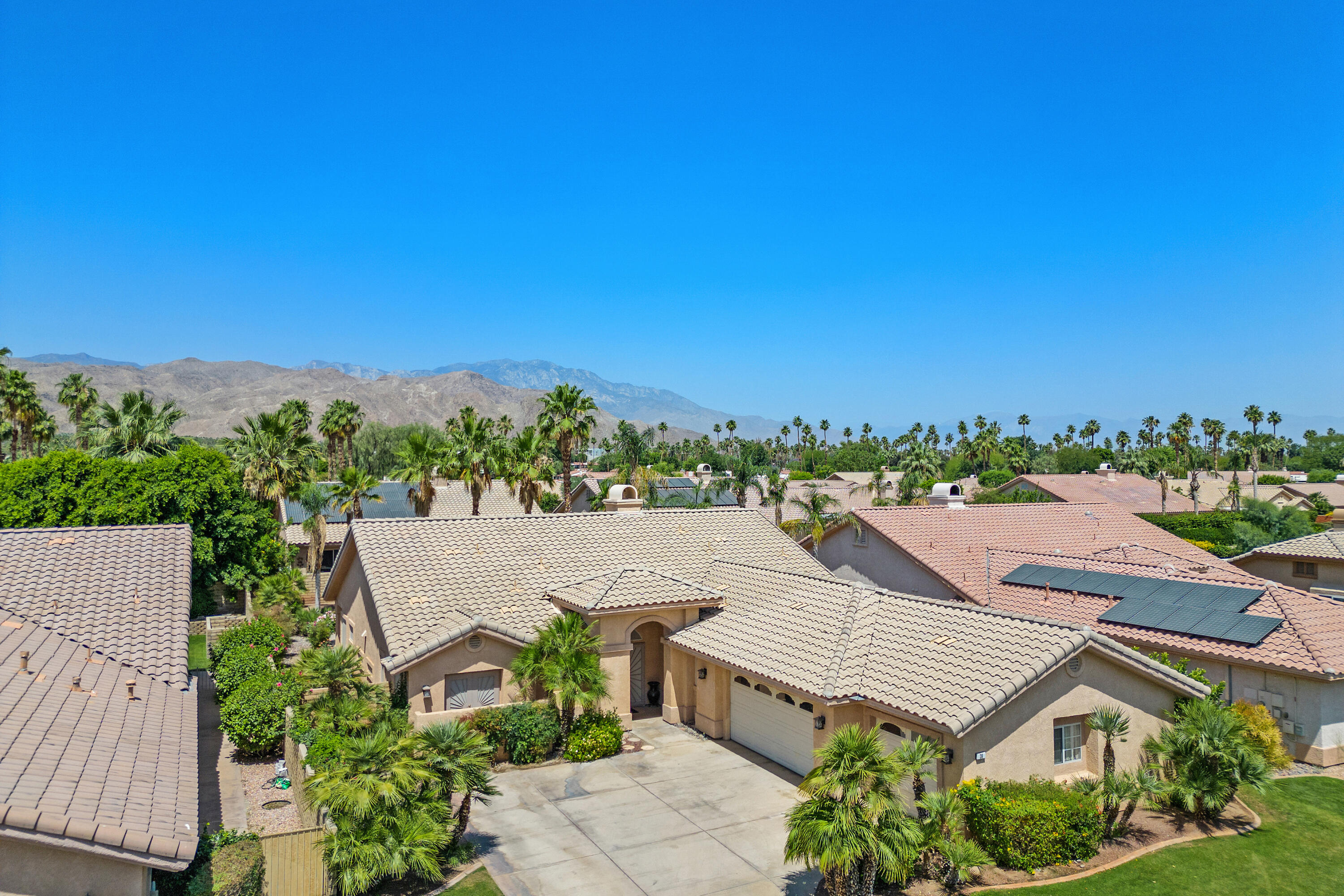 an aerial view of a house with a garden